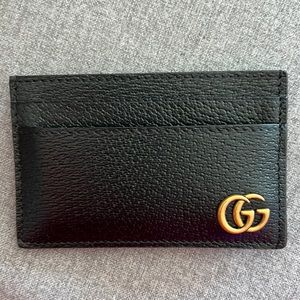 Black leather Gucci wallet.